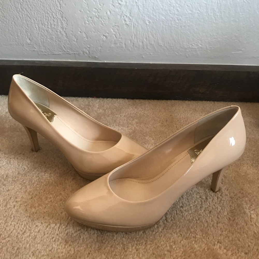 Nude, patent leather heels. Brand new, never worn!